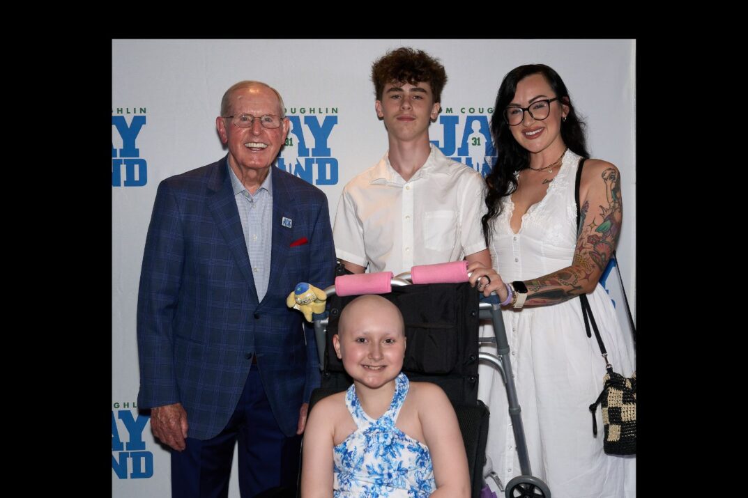Gianna and her family with Coach