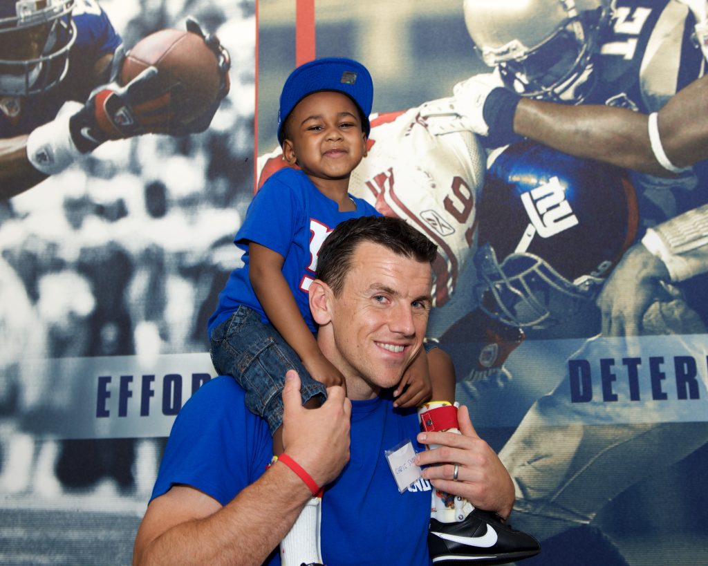 Chris Snee with patient at Sundae Blitz